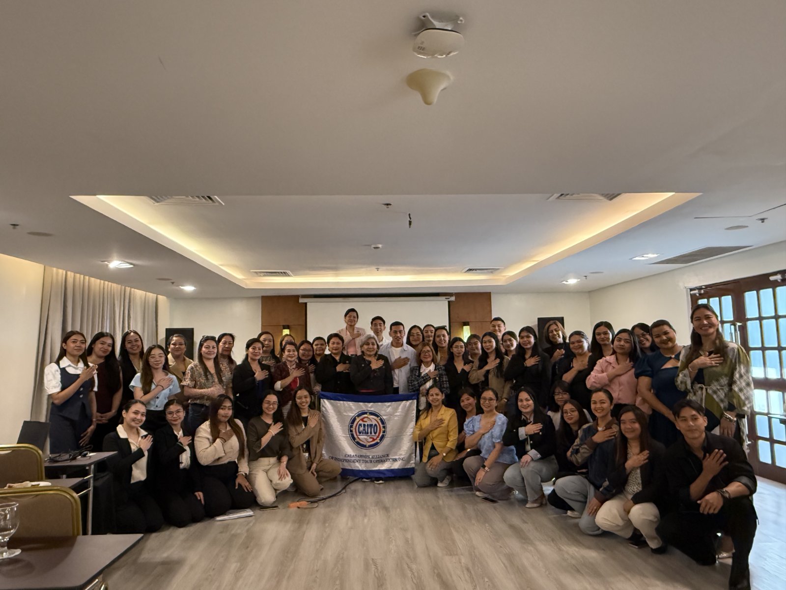 Filipino Brand of Service Excellence participants with hands over their hearts