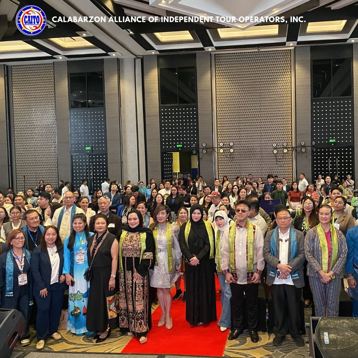 International delegates in traditional attire at the GETS 2026 plenary hall